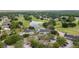 A high angle view features a building, parking lot, and golf course at 5182 Championship Cup Ln, Spring Hill, FL 34609