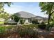 A charming backyard with a screened patio at 5182 Championship Cup Ln, Spring Hill, FL 34609