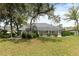 Home's backyard featuring a screened-in lanai at 5182 Championship Cup Ln, Spring Hill, FL 34609