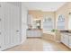Bathroom featuring granite countertops, dual sinks, vanity, soaking tub with tile surround, and a private commode at 5182 Championship Cup Ln, Spring Hill, FL 34609