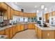 Spacious kitchen with wood cabinets, stainless steel appliances, and granite countertops at 5182 Championship Cup Ln, Spring Hill, FL 34609