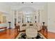 Sophisticated living room with hardwood floors, decorative columns, and ample seating at 5182 Championship Cup Ln, Spring Hill, FL 34609