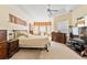 Spacious main bedroom features a tray ceiling, plush carpet, and ample natural light from a bay window at 5182 Championship Cup Ln, Spring Hill, FL 34609