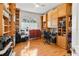 Spacious office with ample built-in shelving, hardwood floors, and a well-lit workspace at 5182 Championship Cup Ln, Spring Hill, FL 34609
