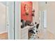 Well-lit office area showcasing a built-in desk, drawers, and adjacent doorway with decorative accents at 5182 Championship Cup Ln, Spring Hill, FL 34609