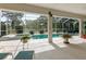 Enjoy the screen enclosed pool and spa, along with the view of the manicured landscaping at 5182 Championship Cup Ln, Spring Hill, FL 34609