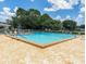 Community pool with ample seating, perfect for relaxation and enjoying sunny days at 5182 Championship Cup Ln, Spring Hill, FL 34609