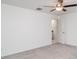 Clean bedroom with ceiling fan and a door to the ensuite bathroom at 5518 Blue Azure Dr, Wimauma, FL 33598