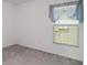This bedroom offers natural light and is ready for a new look at 5518 Blue Azure Dr, Wimauma, FL 33598