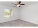This bedroom is bright and airy with a window view and includes a ceiling fan at 5518 Blue Azure Dr, Wimauma, FL 33598