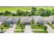Beautifully landscaped single-Gathering home featuring a two-car garage and well-manicured lawn at 5518 Blue Azure Dr, Wimauma, FL 33598