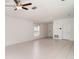 Bright living room with tile floors, ceiling fan, and lots of natural light at 5518 Blue Azure Dr, Wimauma, FL 33598