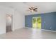 Beautiful open concept living room featuring large windows and modern floors at 5518 Blue Azure Dr, Wimauma, FL 33598
