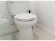 Close-up view of a standard toilet at 5518 Blue Azure Dr, Wimauma, FL 33598