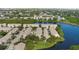 Beautiful aerial view of the community with ponds and mature trees at 568 Shoreham Ne Ct, St Petersburg, FL 33716