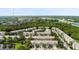 Aerial view of the community showcasing lush greenery, ponds, and well-maintained townhomes at 568 Shoreham Ne Ct, St Petersburg, FL 33716