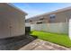 Backyard with green lawn and privacy fence at 568 Shoreham Ne Ct, St Petersburg, FL 33716