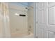 Bathroom featuring a tub with shower and curtain at 568 Shoreham Ne Ct, St Petersburg, FL 33716