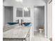 Bathroom featuring a bowl sink, granite counters, modern fixtures, and updated tile flooring at 568 Shoreham Ne Ct, St Petersburg, FL 33716
