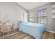 Cozy bedroom design with stylish bed, desk, and bright natural light at 568 Shoreham Ne Ct, St Petersburg, FL 33716