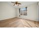 Well-lit bedroom with wood-look floors and large window at 568 Shoreham Ne Ct, St Petersburg, FL 33716