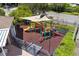 Community playground with slide and shade offers a safe place to play at 568 Shoreham Ne Ct, St Petersburg, FL 33716