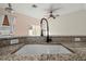 The kitchen sink boasts stainless steel and granite countertops at 568 Shoreham Ne Ct, St Petersburg, FL 33716