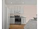 Kitchen featuring stainless steel appliances, granite countertops, and white cabinetry at 568 Shoreham Ne Ct, St Petersburg, FL 33716