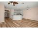 Open floor plan showcases the kitchen with white cabinetry and granite countertops at 568 Shoreham Ne Ct, St Petersburg, FL 33716