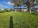 Large backyard with mature trees, providing shade and privacy at 5688 Oakhurst Dr, Seminole, FL 33772