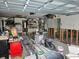 Spacious garage with ample storage shelving and room for workshop, renovation in progress at 5688 Oakhurst Dr, Seminole, FL 33772