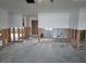 Open-concept interior with exposed framing, offering potential for modern upgrades and customization at 5688 Oakhurst Dr, Seminole, FL 33772