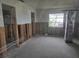 Partially renovated room displaying framing and block walls, perfect for custom design at 5688 Oakhurst Dr, Seminole, FL 33772
