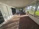 Enclosed patio with mosaic tile, offering a tranquil space with water views at 5688 Oakhurst Dr, Seminole, FL 33772