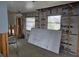 Partially renovated room with exposed framing and insulation, awaiting final finishes at 5688 Oakhurst Dr, Seminole, FL 33772