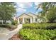 Charming home exterior with a well-manicured lawn, attractive landscaping, and a welcoming front porch at 6005 Shell Ridge Dr, Lithia, FL 33547