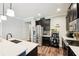 Stylish kitchen featuring stainless steel appliances, dark cabinetry, and ample counter space at 6005 Shell Ridge Dr, Lithia, FL 33547