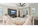 Bright living room featuring a comfortable sectional sofa and sliding doors to an outdoor patio at 6005 Shell Ridge Dr, Lithia, FL 33547