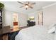Spacious main bedroom featuring hardwood floors, modern furniture, and a walk-in closet at 6005 Shell Ridge Dr, Lithia, FL 33547