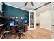 Office space with built in shelves and a French door at 6005 Shell Ridge Dr, Lithia, FL 33547
