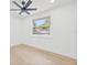 Inviting bedroom with wood-look floors and lots of natural light creates a warm and welcoming atmosphere at 6404 Monterey Blvd, Tampa, FL 33625