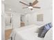 Serene bedroom with a ceiling fan, modern bathroom and closet access at 6404 Monterey Blvd, Tampa, FL 33625