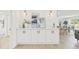 Stylish dining area with white cabinets, quartz countertops and modern decor at 6404 Monterey Blvd, Tampa, FL 33625