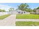 Beautiful home featuring a well-kept lawn, a driveway, and a charming exterior at 6404 Monterey Blvd, Tampa, FL 33625