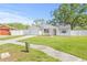 Well-maintained single-Gathering home with a manicured lawn, attached garage and a lovely front yard at 6404 Monterey Blvd, Tampa, FL 33625