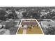 Aerial view of a charming home with a well-kept yard in St. Petersburg, Florida, surrounded by lush greenery and neighborhood streets at 6698 35Th N Ave, St Petersburg, FL 33710