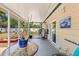 Relaxing screened patio with tropical-themed décor, providing a cozy outdoor living space at 6698 35Th N Ave, St Petersburg, FL 33710