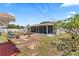 Spacious backyard with patio, mature trees, and a screened patio, creating a perfect outdoor oasis at 6698 35Th N Ave, St Petersburg, FL 33710