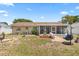 Open backyard with an outdoor seating, fire pit, a screened lanai and a comfortable swing at 6698 35Th N Ave, St Petersburg, FL 33710