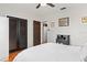Neutral bedroom with a ceiling fan, hardwood floors, mirrored closet and bright white walls at 6698 35Th N Ave, St Petersburg, FL 33710